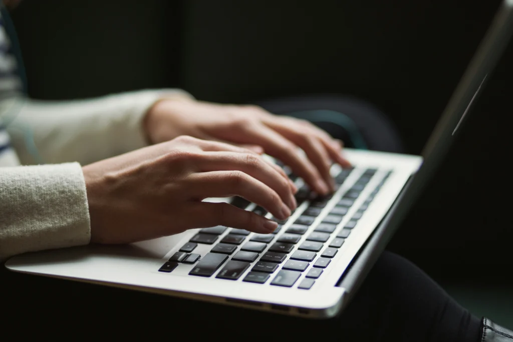 An engineer coding at a laptop